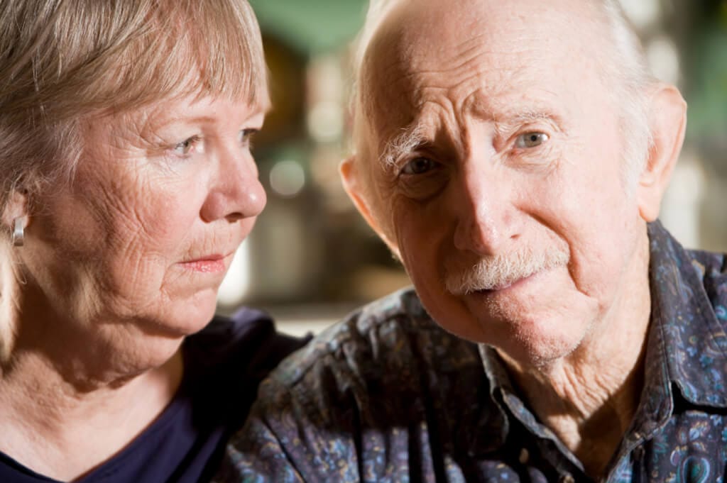 concerned older couple worries about Medicare options